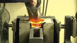 Gold jewelry being smelted down News Clip