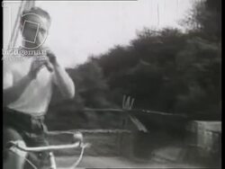 Holiday group cycling through the countryside and visiting Aubusson. France, 1930s Stock Footage