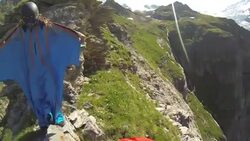 POV wingsuit pre flight preparation on the edge of a cliff Stock Footage
