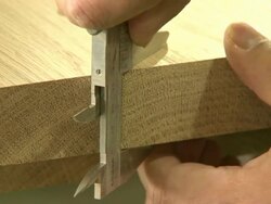 Measuring thickness of plywood with ruler Stock Footage