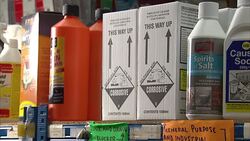 Corrosive cleaning chemicals on shelves in a hardware shop News Clip