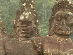 ZI Stone statues along entrance to Angkor Thom / Angkor, Cambodia Stock Footage