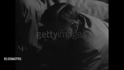 1946: July 16 1945 REPRISING: LOS ALAMOS NIGHT: Jeep sitting in darkness. CU PA speaker. Major General L.R. Groves Dr. Vannevar Bush on ground. Bomb tower in dark (holding 'Gadget' atomic bomb not visible). Instructional Video