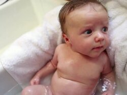MS Shot of mother giving baby bath in sink using shower / Lamy, New Mexico, United States Stock Footage