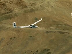 2010 AERIAL Glider flying over barren, rocky mountains / Santiago de Chile, Gran Santiago, Chile Stock Footage