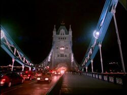MS Traffic crossing Tower bridge at night, London Stock Footage
