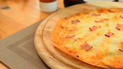 Hawaiian pizza served on a wooden tray Photo Brown. Stock Footage