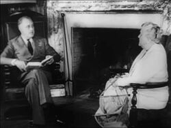 B/W 1932 Franklin Roosevelt sitting by fireplace with book talking to mother Stock Footage
