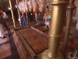 WS DS  Stone of Unction with tourists around in Holy Sepulchre AUDIO / Jerusalem, Jerusalem, Israel Stock Footage