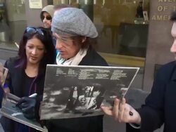 Aerosmith guitarist Joe Perry leaving SiriusXM Satellite Radio signs for fans Stock Footage
