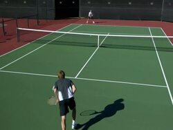 SLO MO, HA, WS, Two young men playing tennis, Santa Barbara, California, USA Stock Footage
