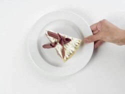 CU Woman hand entering setting down round white plate with slice of French silk chocolate pie dessert / Omaha, Nebraska, United States Stock Footage