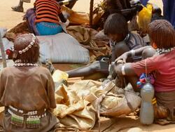 MS Market with Bena tribes selling items and talking in crowded market / Dimeka, Ethiopia Stock Footage