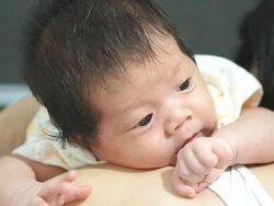 Baby on mother shoulder Stock Footage