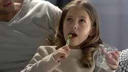 Child brushing her teeth before bedtime Stock Footage