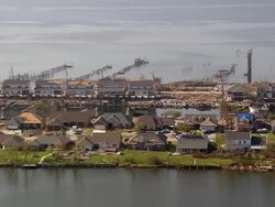 September 13, 2005 aerial over destroyed houses and debris along Grand Lagoon / Slidell, Louisiana Stock Footage
