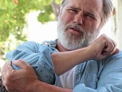 Slow motion elbow pain in close up Stock Footage