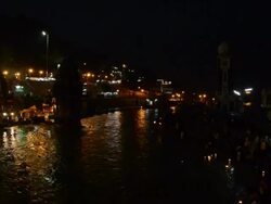 MS People praying in ganges river bank at night / Haridwar, Uttarakhand, India Stock Footage