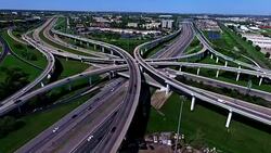 Timelapse Fast Shot Futuristic Over Pass Highway Interchange Overpass Fly Over Aerial Transportation in Austin , TX Stock Footage