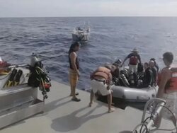 MS Shot of Scuba diving group arriving back to dive boat  / Socorro Islands, Mexico Stock Footage