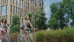 Couple riding bicycles in the city Stock Footage