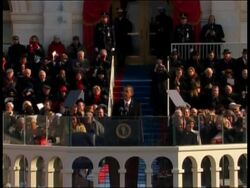 Stepping into history, Barack Hussein Obama grasped the reins of power as America's first black president on Tuesday, declaring the nation must choose 'hope over fear, unity of purpose over conflict and discord.' News Clip