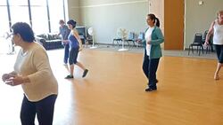 Active senior and young women learning to line dance Stock Footage