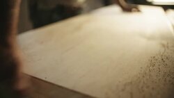 Middle-Aged White Male Cleans Sawdust from Wood Stock Footage