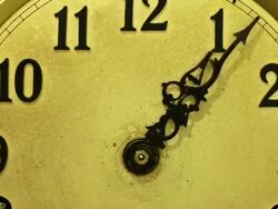 Timelapse zoom and track in to the face of an old clock going backwards, Putting the clock back.  Going back in time. Stock Footage