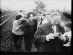 B/W 1961 two female defectors from East Berlin walking with group of men after escape / Germany Stock Footage