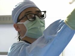 Doctors in operating room performing surgery Stock Footage