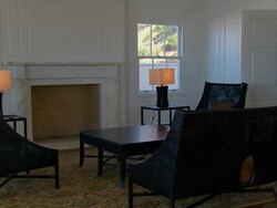 ZI A mid-century living room suite arranged in front of a fireplace / Santa Monica, California, United States Stock Footage