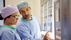 Surgeons discussing MRI scans Stock Footage