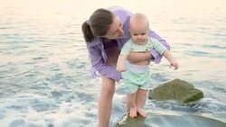 baby meets the sea Stock Footage