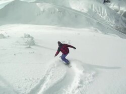 A snowboarder carving a mountain in winter. - Slow Motion - Model Released - HD Stock Footage