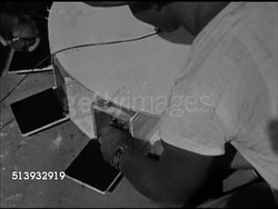 1946: RED CROSS: TOAD JUMPING CONTEST:  WS Banner, 'Toad Jumping...' VS Veteran soldiers & female Red Cross workers gathered around outdoors, people preparing toads, male blowing on bugle. VS Releasing toads, toads jumping around, audience. Not frogs Instructional Video