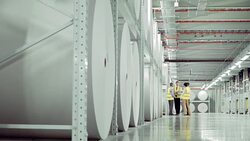 Business people talking in paper mill Stock Footage