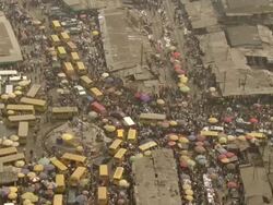 WS AERIAL View of market with men like ants / Lagos, Nigeria Stock Footage