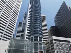 High Rising Buildings at Raffles Square, tilt up, daytime, Singapore Stock Footage