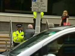 2008 MS PAN Amy Winehouse being escorted into police station to face assault charges on April 25, 2008 / London, England/ AUDIO Stock Footage