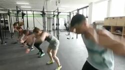 Group of athletes doing crossfit burpees Stock Footage