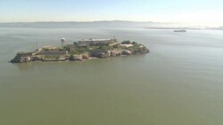 A road winds around the former prison at Alcatraz Island in San Francisco Bay. Stock Footage