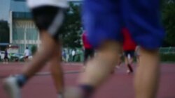 Group of people jogging on the running track Stock Footage