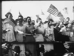 B/W 1917 PAN women waving US flags at war bonds rally / WW I / documentary Stock Footage