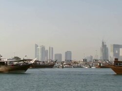 WS PAN View of Skyline of city and moored boats / Doha, Qatar Stock Footage