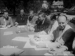 1952: ADLAI STEVENSON II: VS Adlai Stevenson II sitting in the middle of long table w/ other males, officials, outdoors, Stevenson talking (partial SOT) about first Presidential campaign being followed so closely by press & television. Politics Instructional Video