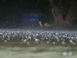 CU Shot of small hail mixed with raining on ground level / Lemmon, South Dakota, United States Stock Footage