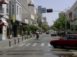 MS PAN View of city and man riding his motorcycle down calm street AUDIO / Tel Aviv, Israel Stock Footage