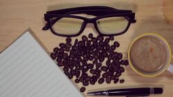 Wood desk with books and office supplies coffee. Stock Footage