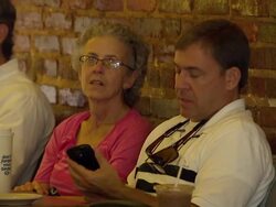 Customers drinking coffee in coffee shop News Clip